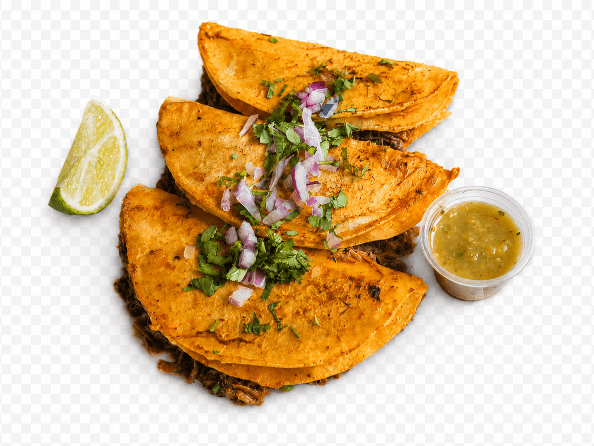 Three crispy quesabirria tacos with a lime wedge and green salsa.
